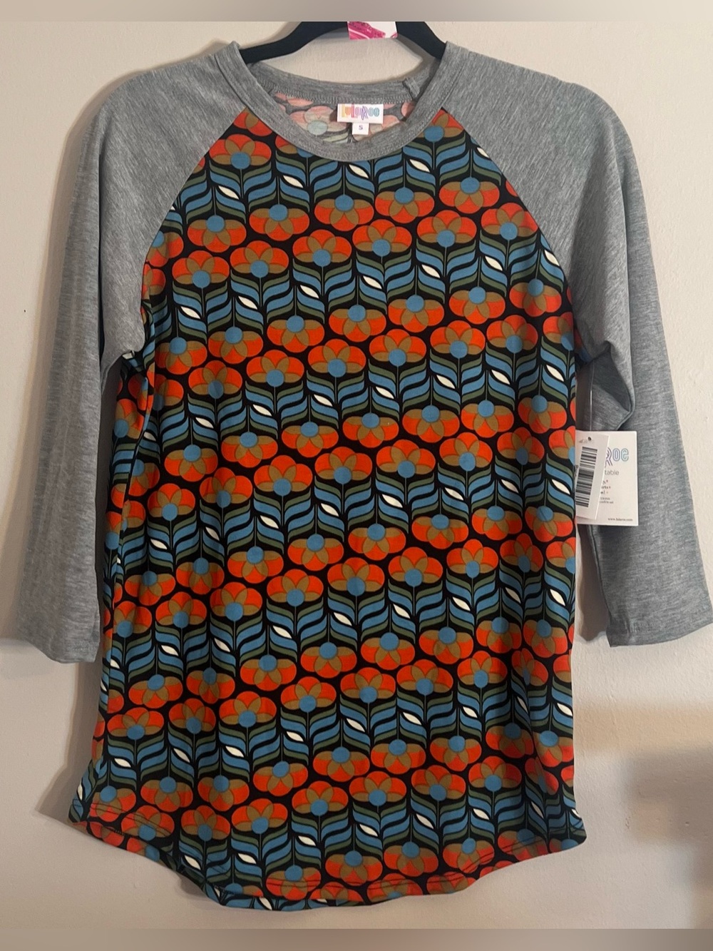 LuLaRoe Grey Raglan Top with Orange and Teal Floral Geometric Print